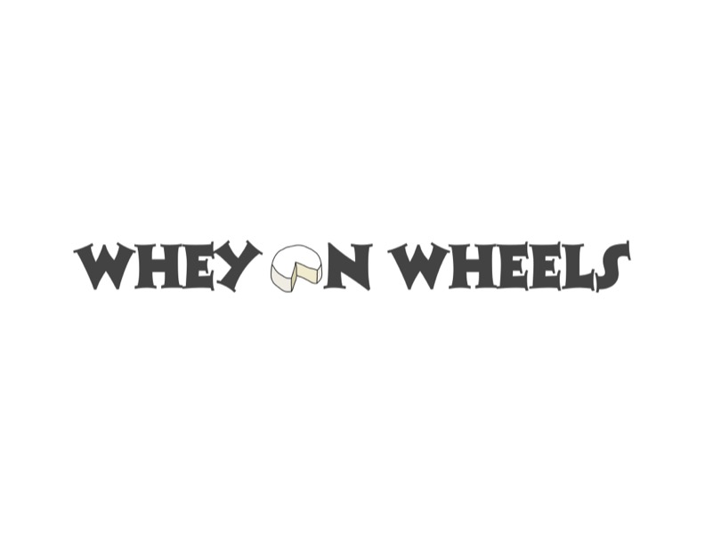 Whey On Wheels logo, featuring the black, all caps words Whey On Wheels in an old timey font. The O in On is a line drawing of a cheese wheel with a slice cut out.
